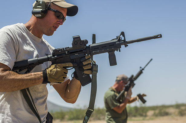 Numerous optics and accessories were used during the brass vs. steel ammo test. Shooters line up to fire during the brass vs. steel test.