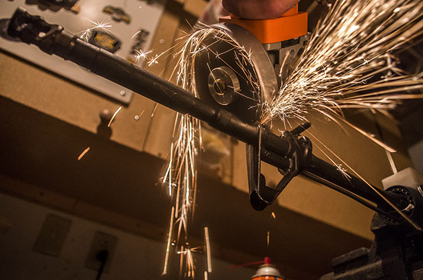 Cutting into the barrel of an AR-15 A saw cuts into the barrel of an AR-15 during the steel vs. brass test.