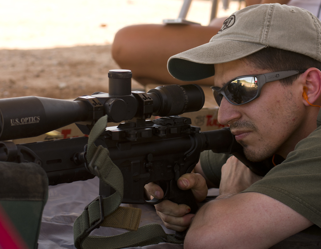 A Marine infantryman and marksmanship instructor prepares to test accuracy. A Marine infantryman and marksmanship instructor prepares to test accuracy.